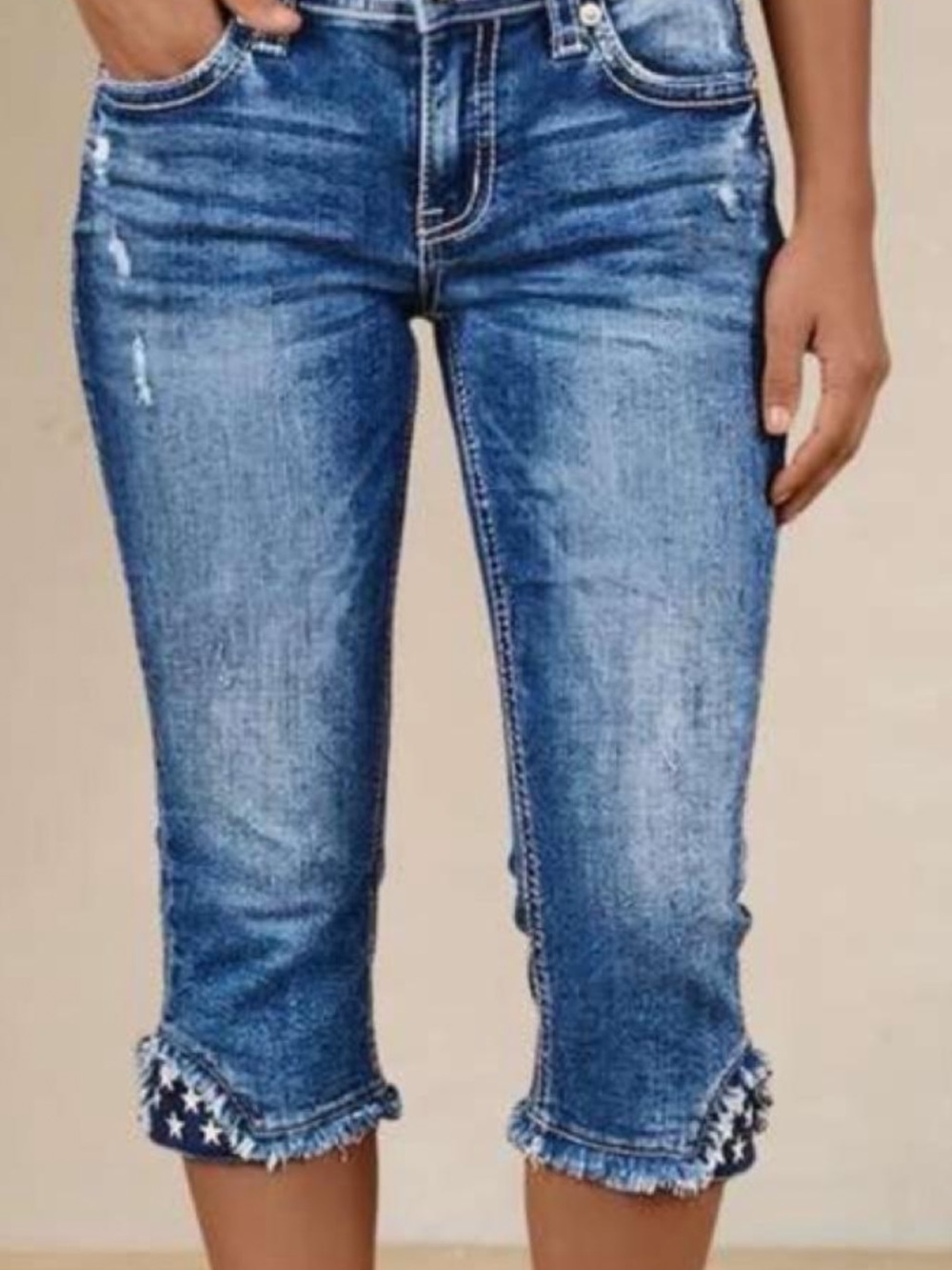 Women’s Distressed Blue Crop Jeans with Frayed Star Hem